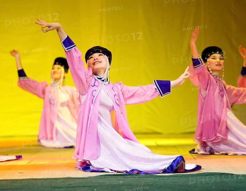 ULAN-UDE, RUSSIA - APRIL 16: Unidentified Buryat female dancers in national dresses perform at fashion show of Radzhana Baldayeva, a known hair stylist, April, 16, 2010 in Ulan-Ude, Buryatia, Russia, Europe