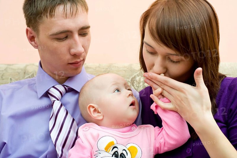 Young caucasian couple with their little baby