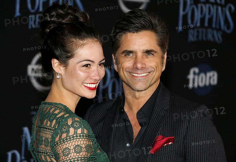 Caitlin Mchugh and John Stamos at the World premiere of Disney's 'Mary Poppins Returns' held at the Dolby Theatre in Hollywood, USA on November 29, 2018