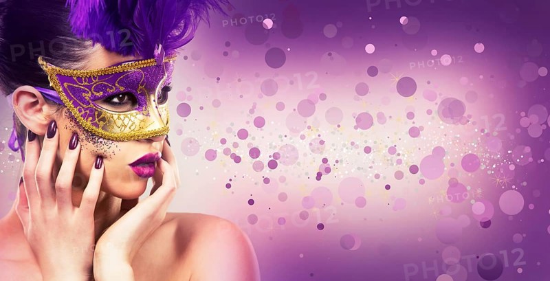 Beautiful woman with dramatic mekaup and pruple lipstick wearing puprle mask. Light background. Golden, Toronto, Canada, North America