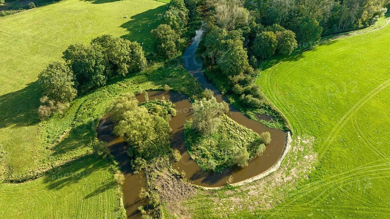 Aerial view of a beautiful green landscape with a small river flowing through. It is in the eastern part of the Netherlands