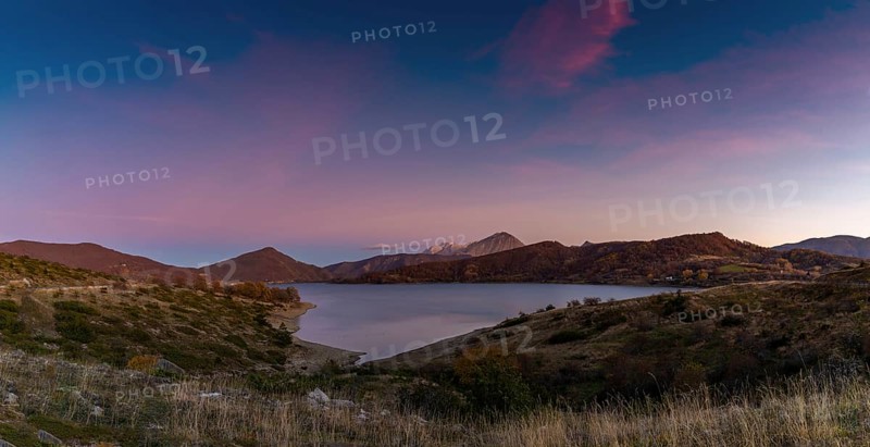 A panorama landscape of Lago di Campotosto in Abruzzo at sunset