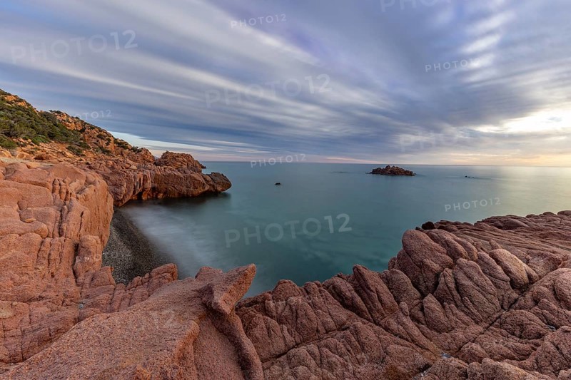 Coast with bizarre red rocks and sea view at sunset, long exposure, Spiaggia di Cala E'Luas, Ogliastra, Sardinia, Italy, Europe