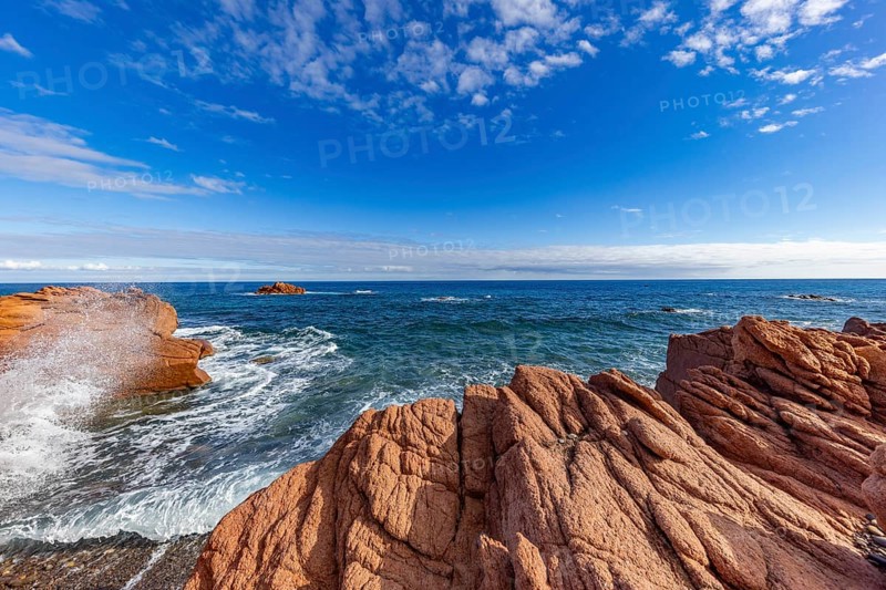 Coastal landscape with red rocks and surf in blue sky and sunshine, Spiaggia di Cala E'Luas, Ogliastra, Sardinia, Italy, Europe