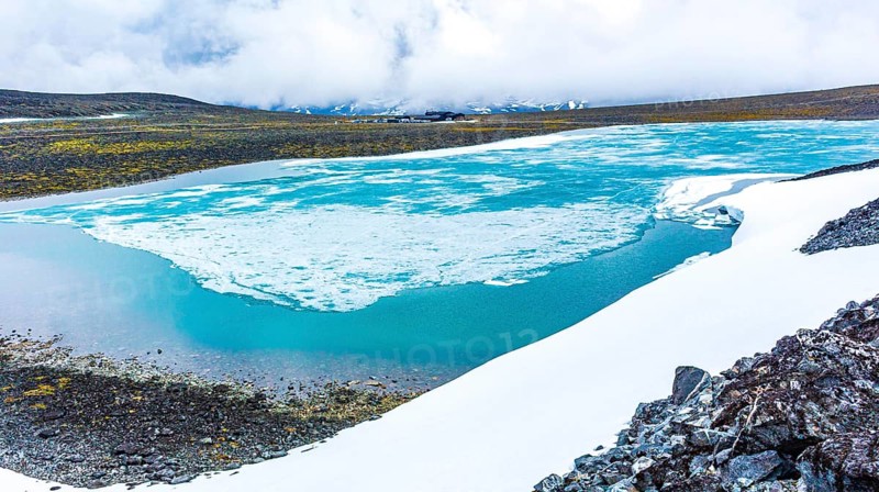 Galdhøpiggen snow-covered in summer in Jotunheimen Lom in Norway is the largest and highest mountain in Norway and Scandinavia with 2469 meters