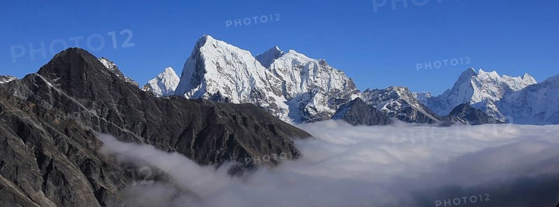 Sea of fog and peaks of Ama Dablam, Cholatse and Tobuche