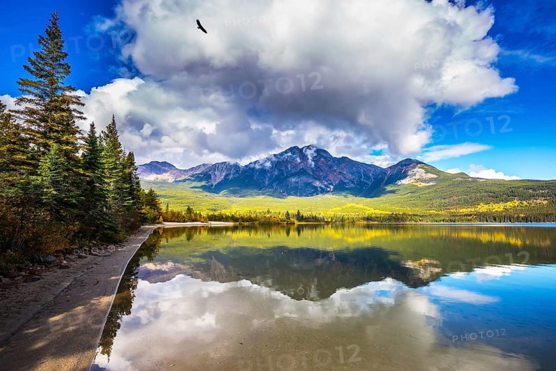 Frosty morning in the Rocky Mountains, Canada. Pyramid Mountain reflected in the smooth water of Pyramid Lake