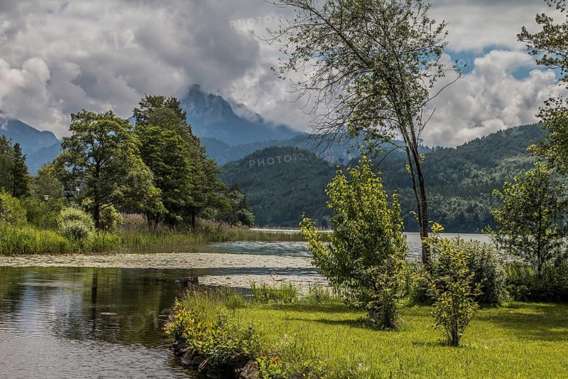Lake Weissensee to the west of Füssen in the district of Ostallgäu, with the Ammergau Alps and the Säuling in the background