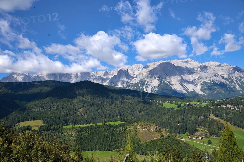 Panoramic view of the mountains with the Dachstein massif in green Styria - Austria