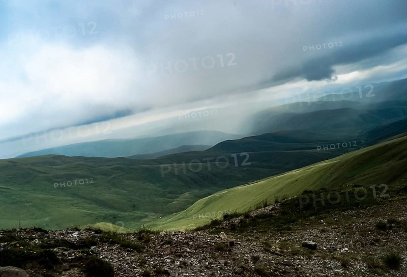 Mountain landscape with grass in the hills. Mountain landscape. Mountain vegetation