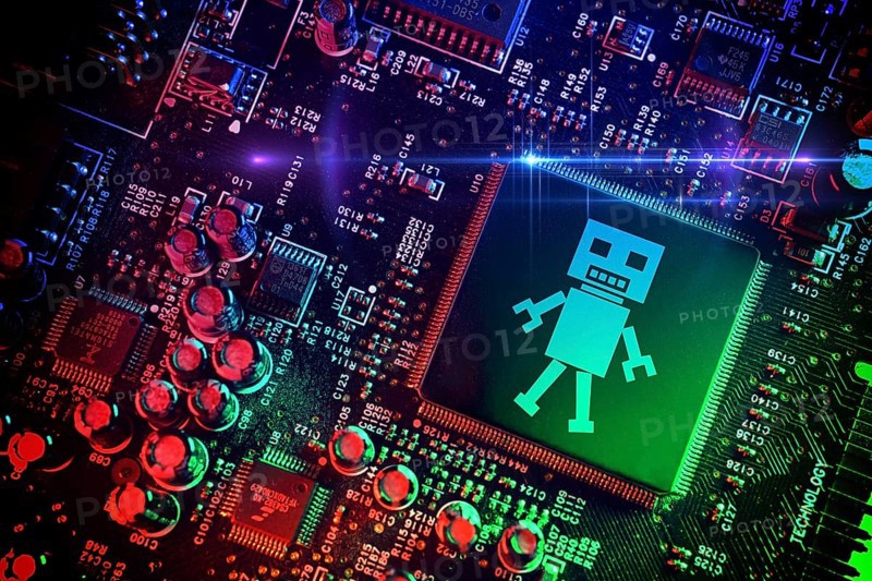 Computer chip with robot symbol, artificial intelligence, photomontage