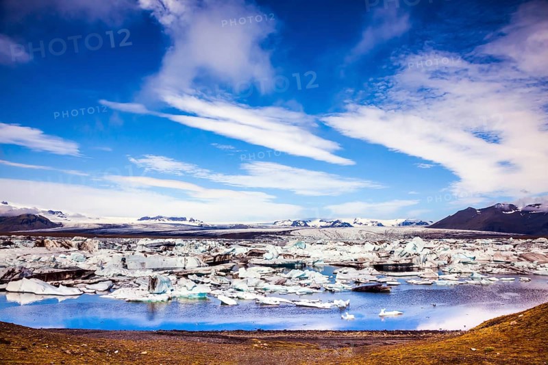 Sunrise in the Ice Lagoon. Drift ice Ice Lagoon - Jokulsarlon. Ice floes are reflected in the smooth water surface. The concept of extreme northern tourism