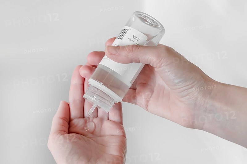 Hand sanitizer gel. Disinfecting hands. Taking disinfection alcohol gel on hands to prevent virus epidemic. Prevention of flu disease. COVID-19. Coronavirus. Cleaning and disinfecting hands in proper way