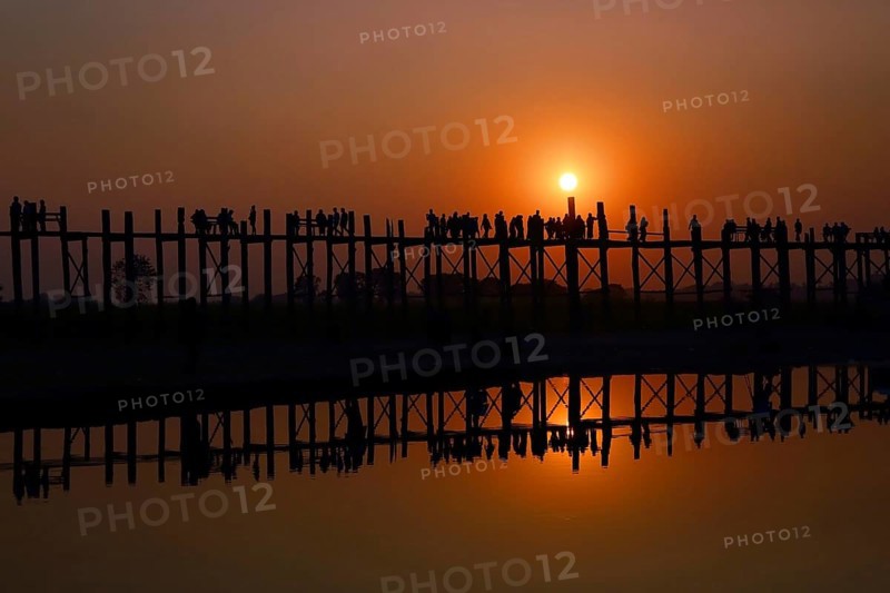 Famous U-Bein teak bridge at sunset on Taungthaman lake in Amarapura, Mandalay division, Myanmar, Asia