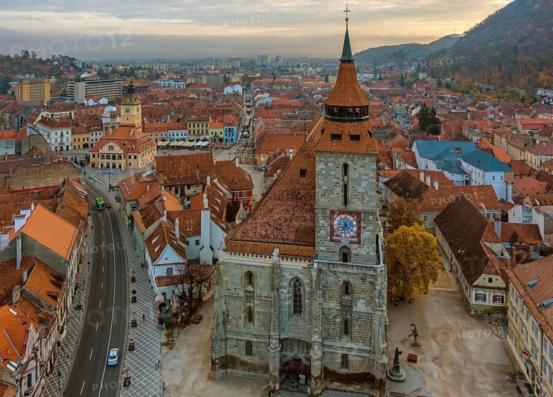 Aerial view of Brasov old town with Black Church and Piata Sfatului square in autumn morning, Transylvania region, Romania, Europe