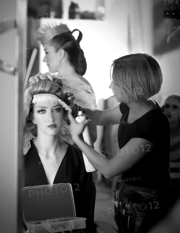 Backstage hairdressing and makeup fashion with make-up artist