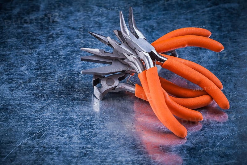 Composition of insulated electric gripping tongs nippers top view image