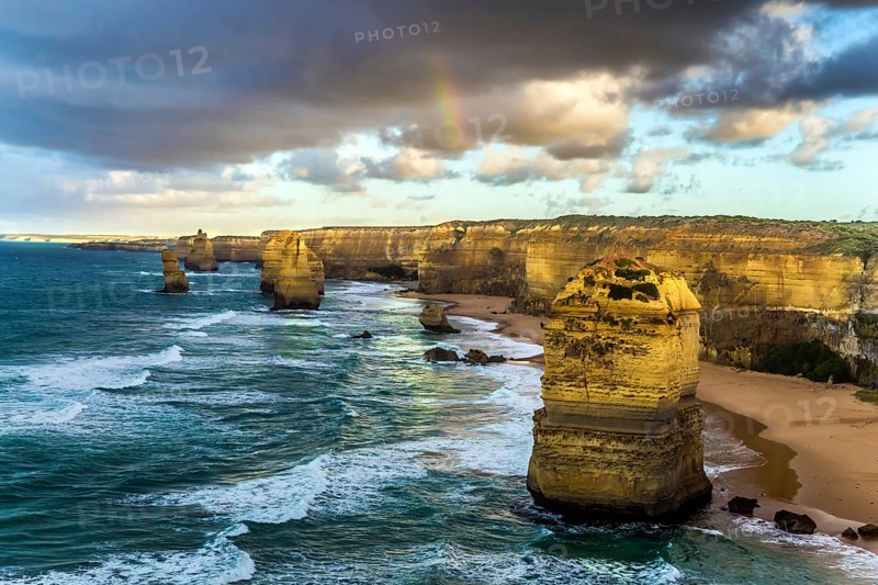 The rocks Twelve Apostles in an ocean storm surf. Travel to Australia. Fantastic morning light on the Pacific coast about Melbourne. Concept active and phototourisme