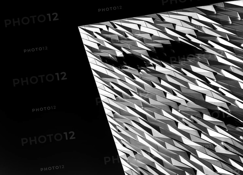 Belfast, United Kingdom, 21 August, 2022: close-up architectural detail of the steel and aluminium Titanic Museum in downtown Belfast in black-and-white, Europe