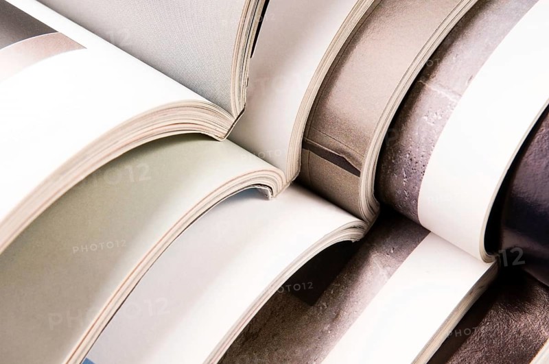 Stack of open magazines