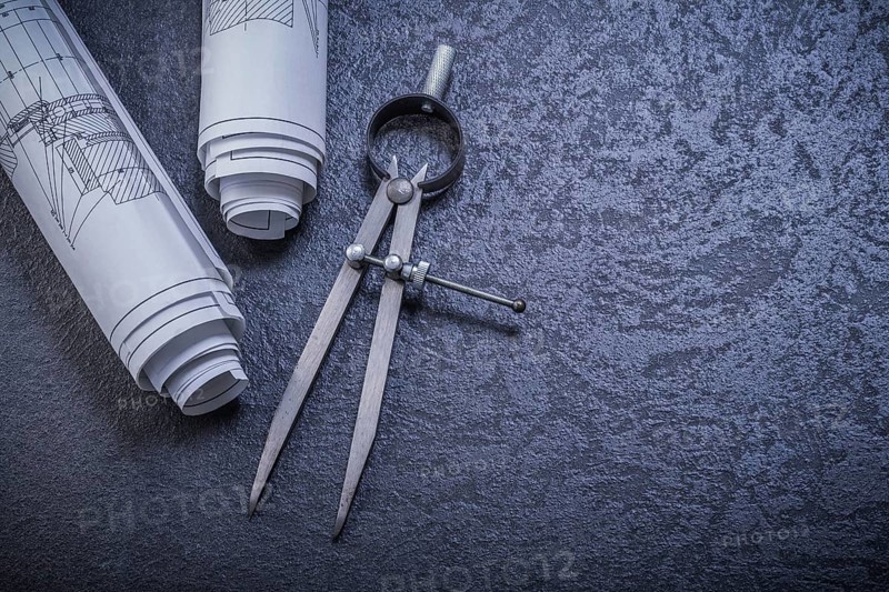 Construction plans pair of compasses on black background maintenance concept