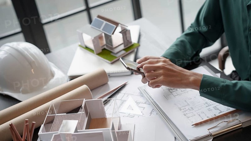 Architecture Man use smart phone for architectural Creative project business architecture ecosystem building construction Industrial engineering Design