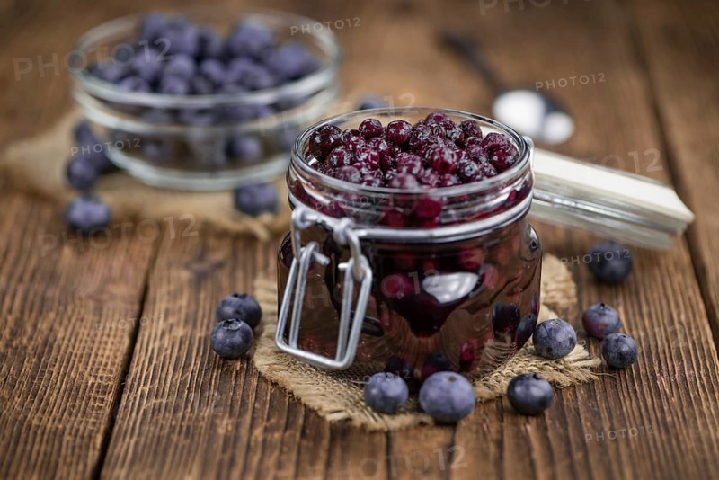 Fresh made Blueberries (preserved) on an old and rustic wooden table, selective focus, close-up shot