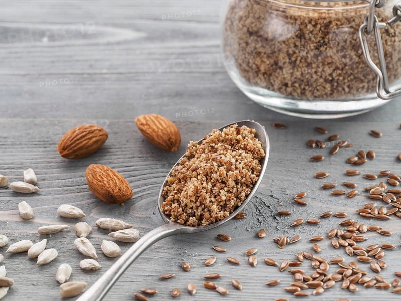 Homemade LSA mix in spoon - Linseed or flax seeds, Sunflower seeds and Almonds. Traditional Australian blend of ground, source of dietary fiber, protein, omega fatty acids. Copy space for text
