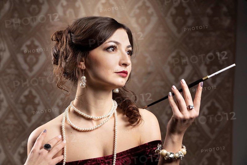 Retro portrait of a woman. Beautiful woman in the style of the 20s or 30s with a mouthpiece