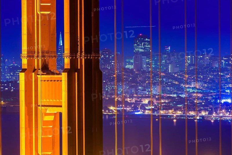 San Francisco Golden Gate Bridge sunset view through cables in California USA