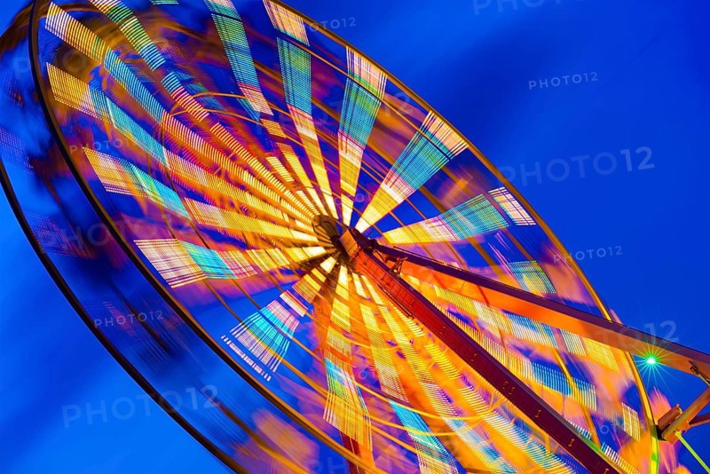 Turning illuminated ferris wheel shot at long exposure