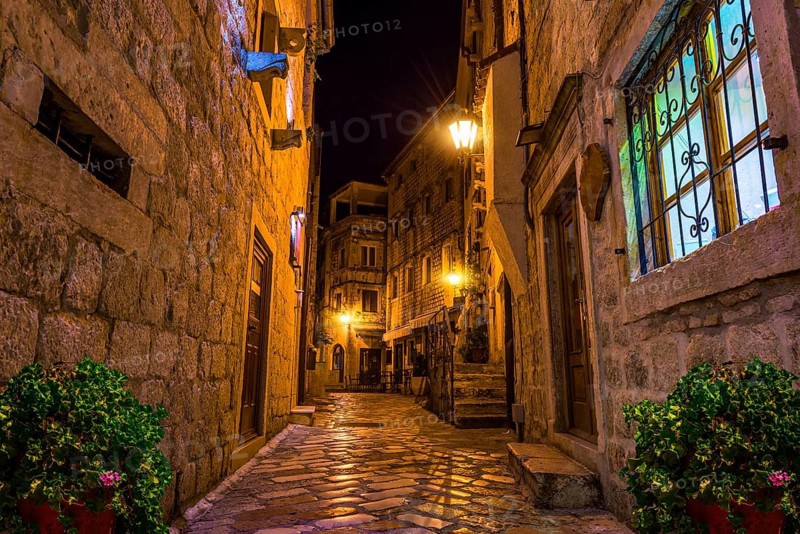 Narrow street of Old Town in Kotor at night