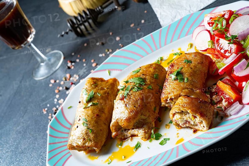 Roast pork vegetable roulade with salads