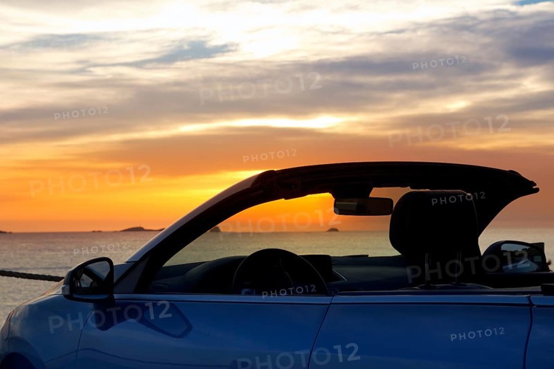 Ibiza cala Conta Conmte sunset in convertible car
