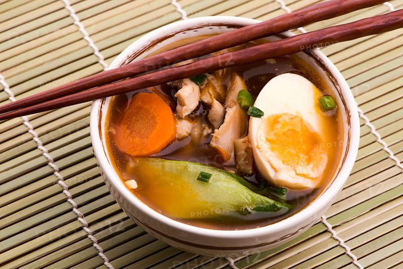 Ramen egg noodle soup dish with salmon fish
