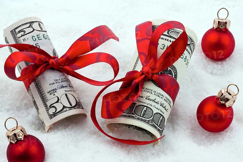 Dollar banknotes with ribbon as a gift of money, Austria, Europe
