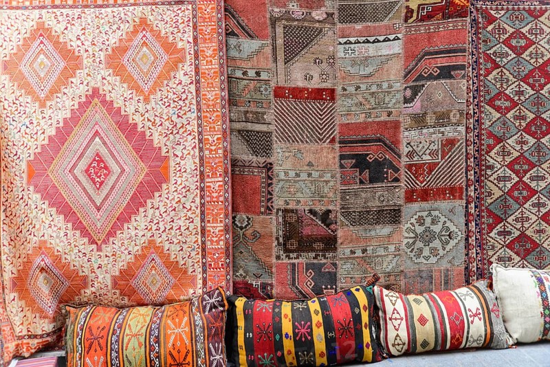 Grand Bazaar, Istanbul, Turkey, Asia, Various traditional carpets and colourful cushions with patterns on display, Istanbul Modern, Asia
