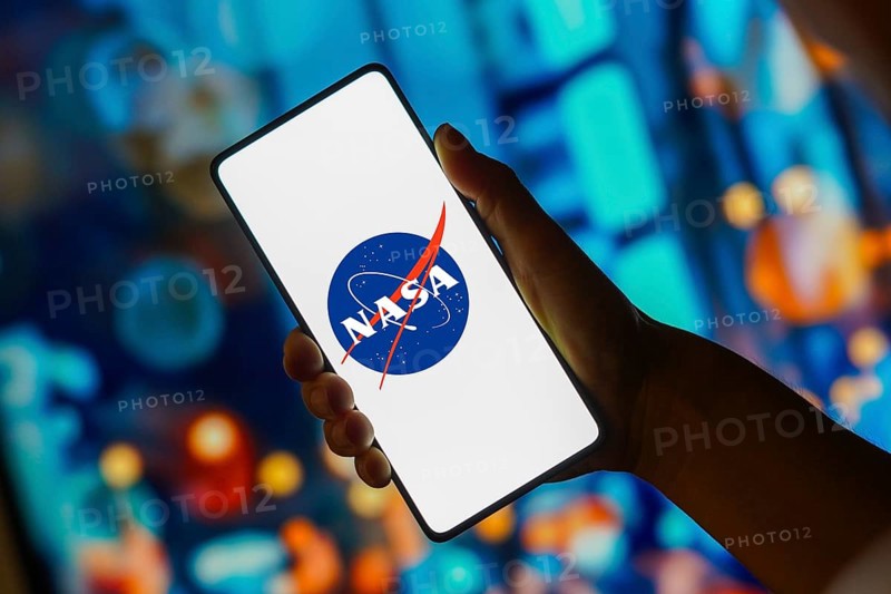 In this photo illustration, the NASA (National Aeronautics and Space Administration) logo is displayed on a smartphone screen