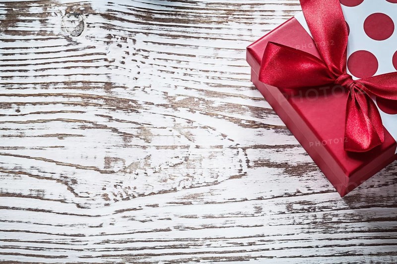 Packed present box on vintage wooden board copy space holidays concept