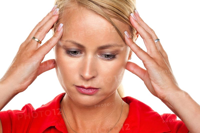 A pensive young blonde woman with a headache and migraine, 25, 30, years Studio shot, Federal Republic of Germany