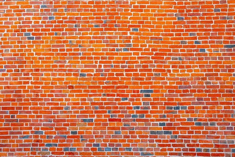 The background of the old red brick wall for design interior and various scenes or as a background for video interviews