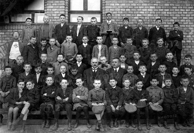 Boys school class, 1920s, Historical school class photo with boys and teachers in front of a brick building, all in formal dress, Historical photo
