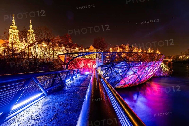 Illuminated Murinsel, Mariahilferkirche in the background, night shot, Graz, Styria, Austria, Europe
