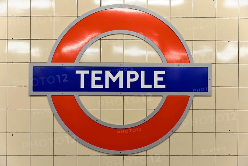 The red and blue Tube logo of Temple Station on a tiled background, London, London region, England, United Kingdom, Europe