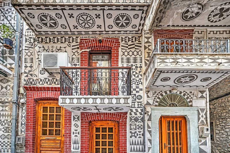 Traditional houses decorated with the famous geometric scratch patterns in the medieval mastic village of Pyrgi on the island of Chios, Greece, Europe