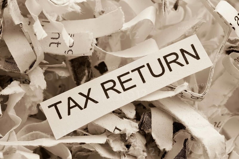 Paper shreds with the keyword Tax Return, symbolic photo for data destruction, data protection and tax law