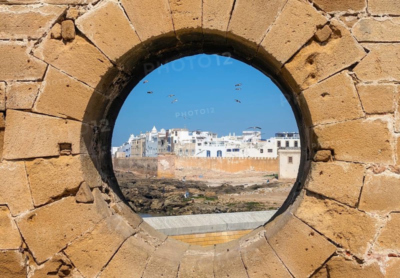Famous view of medina Essaouira through a hole in the wall of the fortress, Morocco, Africa