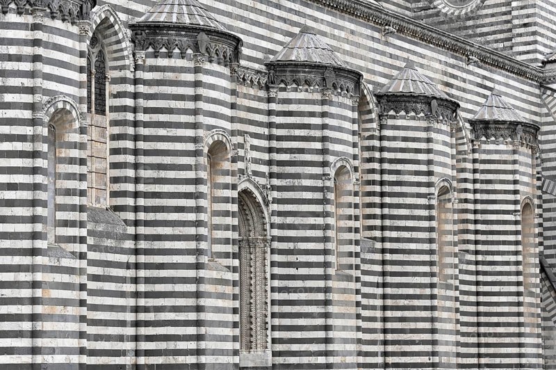 The Cathedral Basilica of Santa Maria Assunta, Orvieto, Terni, Umbria, Italy, Close-up of a striped façade with Gothic windows, Orvieto, Italy, Europe