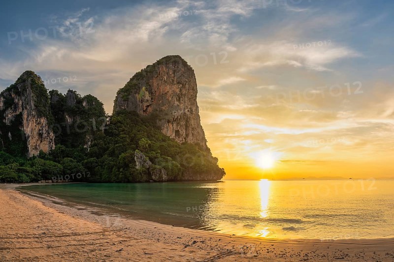 Tropical islands sunset view with ocean sea water and sand beach at Railay Beach, Krabi Thailand nature landscape