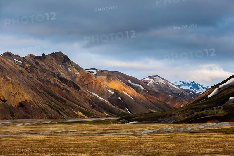 Mountains and hills with blotches of snow in Landmannalaugar, Iceland, Europe